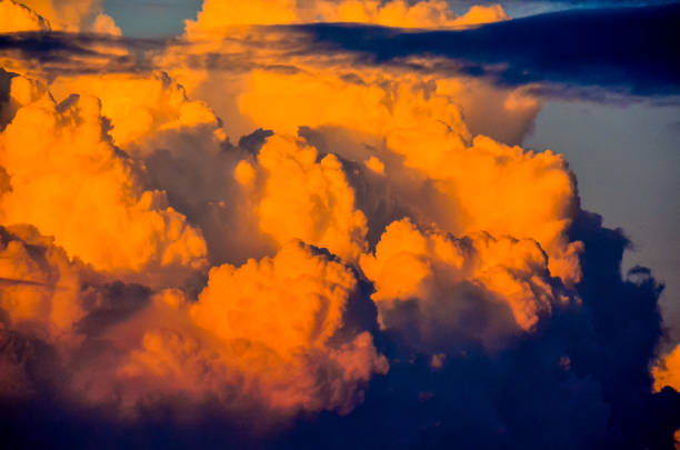 The sky is filled with orange clouds. The clouds are very large and are scattered throughout the sky