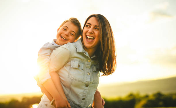 istock Nice mother and child Playing on great field at Sunset 2156923787