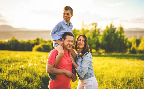 Nice family Playing on great field at Sunset