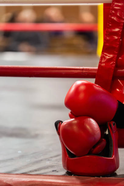 Boxing gloves and head protector close up. Combat sport concept.