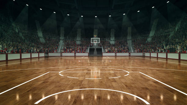 Empty basketball arena with perfectly placed markings, illuminated by powerful lights nd crowdy stages on background.