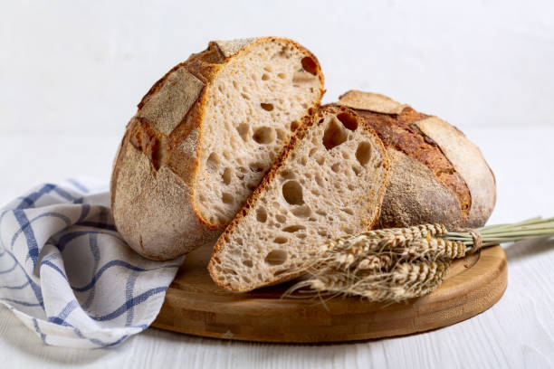 istock Homemade rustic bread and slice of bread. 2156928099