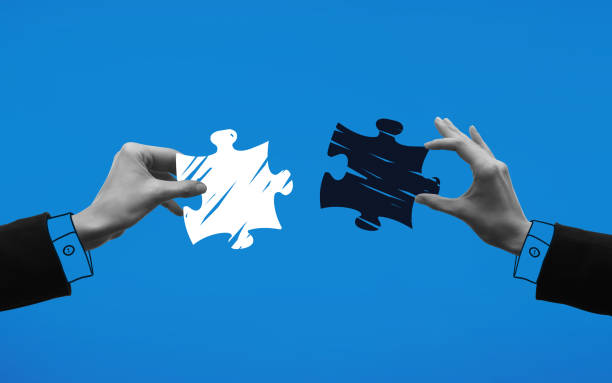 Contemporary art collage. Hands holding puzzle pieces and trying to connect it against blue background. Contemporary art collage. Hands holding puzzle pieces and trying to connect it against blue background. Concept of business, acquisition, retention, merger, partnership, office, mergers and acquisitions stock pictures, royalty-free photos & images