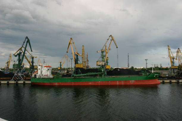Riga, Latvia - 06 15 2008: Coal freight transportation ship loading in port Riga, Latvia.