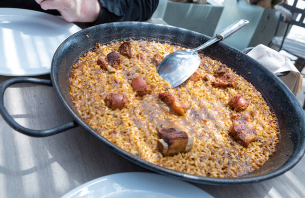 istock Serving a Paella in Spain - Meat paella, Mountain type 2156931562