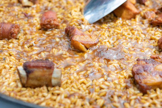 istock Serving a Paella in Spain - Meat paella, Mountain type 2156931574