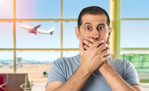 istock Shocked man covering his mouth 2156932066