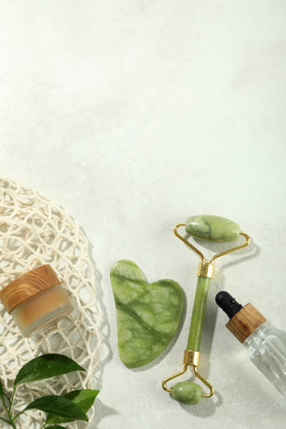 istock Face care concept with gua sha, face roller and cosmetic 2156933478