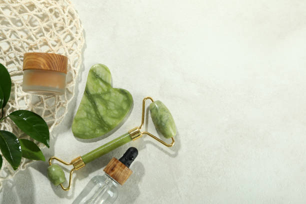 istock Face care concept with gua sha, face roller and cosmetic 2156933816