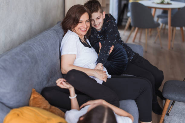 istock Boy hugging his mother and laughing 2156935983