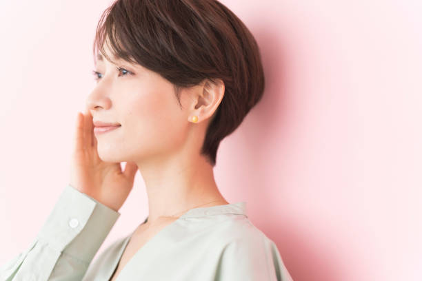 istock A middle-aged Japanese woman touching her cheek. 2156942245