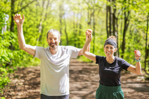 istock Couple jogging and running outdoors in nature 2156950925