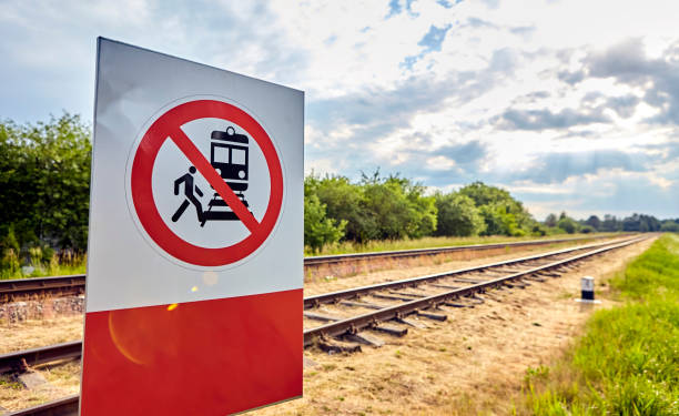 istock Warning Sign Prohibiting Access to Railway Tracks Under the Bright Sunlight 2156953168