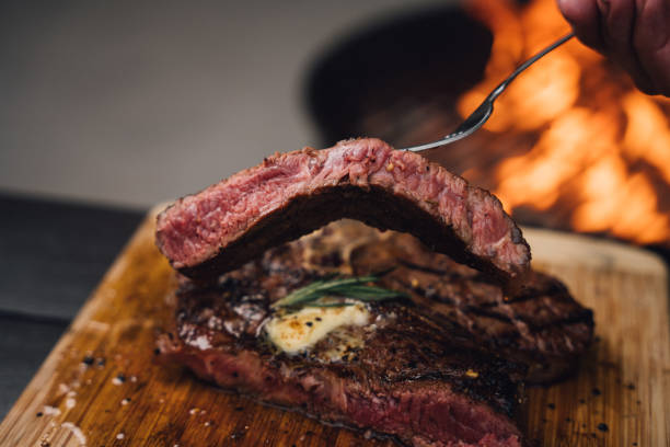 istock A Perfectly Cooked T-Bone Steak Cooked on a Charcoal Grill 2156953916