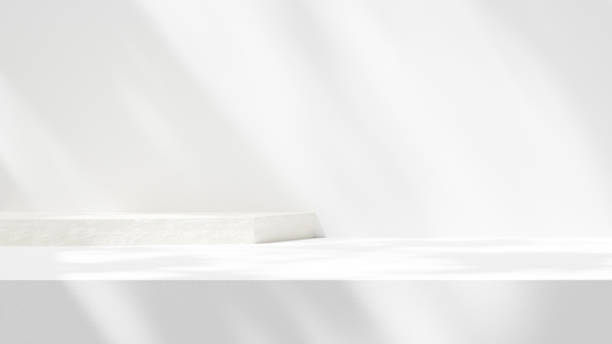 istock Background empty podium display made white cement plinth for showcasing merchandise in landscape 2156954566