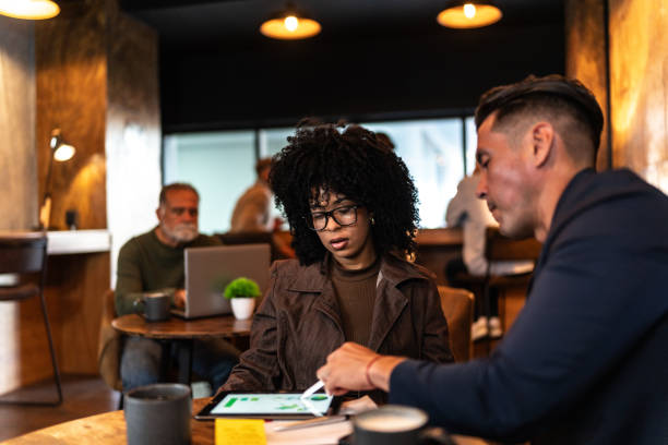 istock Coworkers talking during meeting at office 2156955745