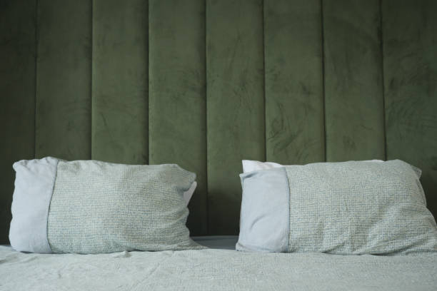 istock Create a cozy bedroom with a green headboard and twin pillows for a modern look 2156960883