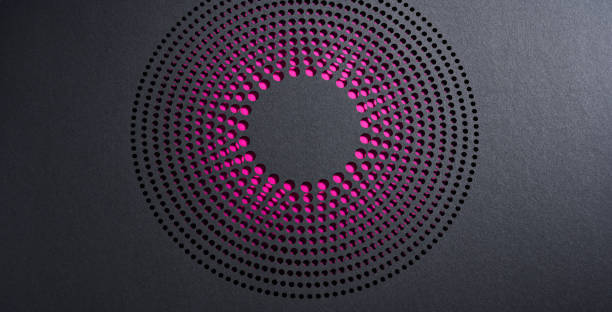 istock Intricate Circular Paper Art with Pink Dots Creating a Radial Pattern on Dark Background 2156962556