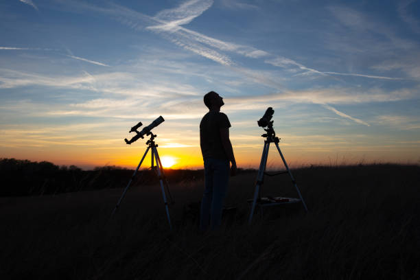 istock Amateur astronomer observing Solar eclipse and Sun with a telescope and special solar filter. 2156963088