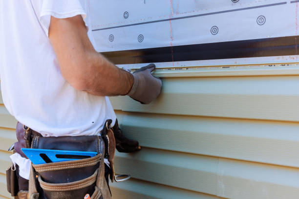 istock Handyman process installing vinyl PVC siding during construction on a facade new home 2156964884