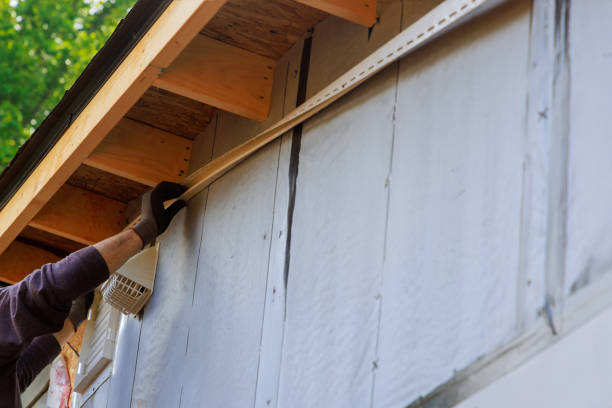 istock During construction of house, a craftsman nails J-channel vinyl trim before installing it for siding 2156964892