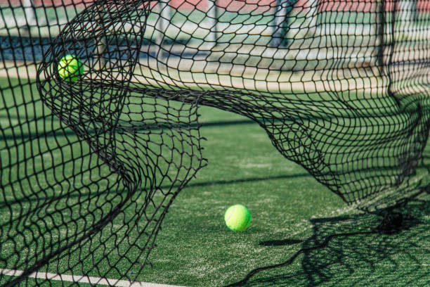 istock tennis net movement by hitting a green ball 2156965070