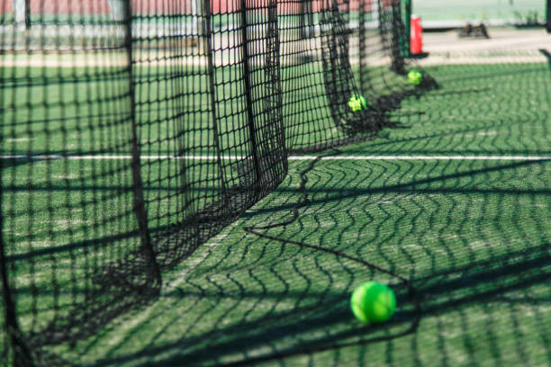 istock padel court net with ball on the ground 2156965092