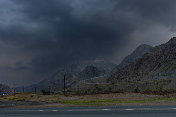 istock Road Trip Through Majestic Mountains Under Cloudy Skies 2156966318