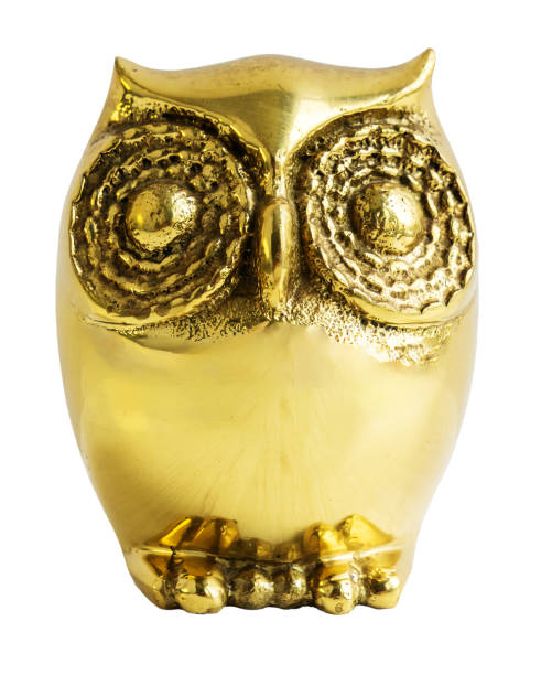 istock Gold metal owl figurine isolated on white background. Front view. 2156966697