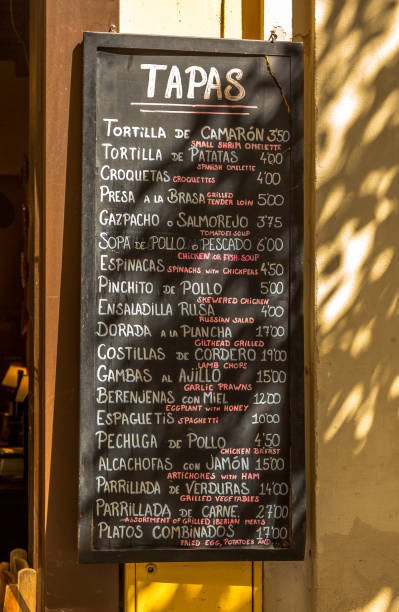 istock A traditional, hand-written tapas menu written in white chalk on a blackboard outside a restaurant in Seville, Spain 2156967416