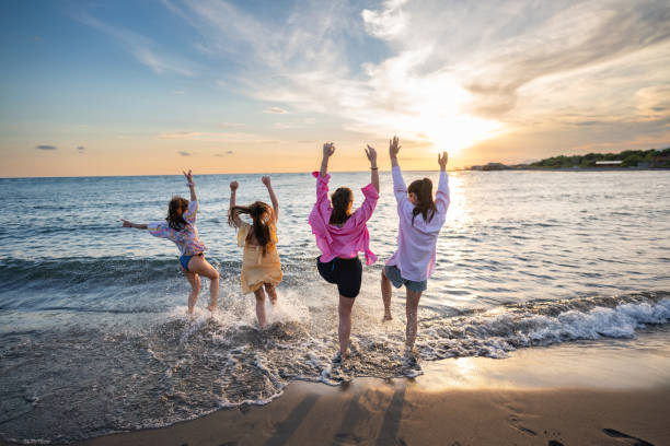 istock Playful friends having fun on the beach 2156969655