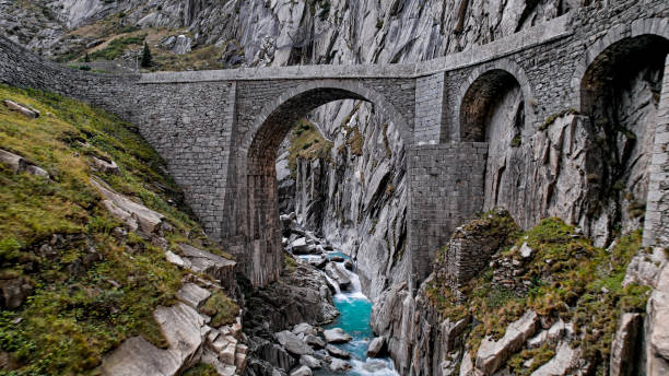 istock Devil's Bridge (Teufelsbrucke) over of Schollenen Gorge (Schollenenschlucht) in Andermatt, Switzerland 2156970945