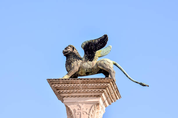 istock A lion with wings is perched on a pillar 2156971597