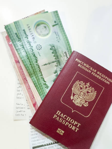 istock Russian passport and Arab Emirates Banknotes 2156971922