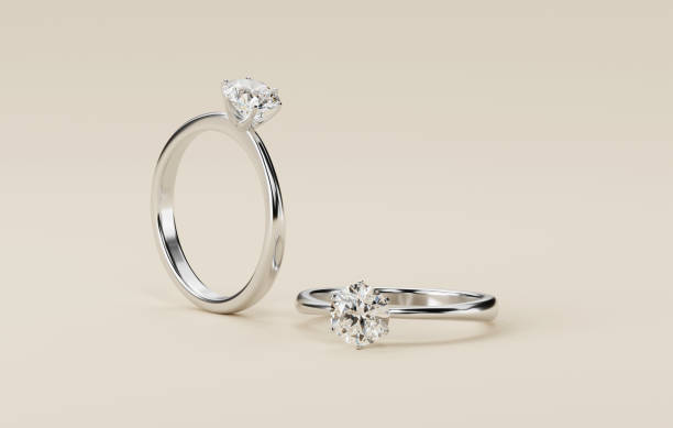 istock Couple diamond rings placed on white background 3d rendering 2156972027
