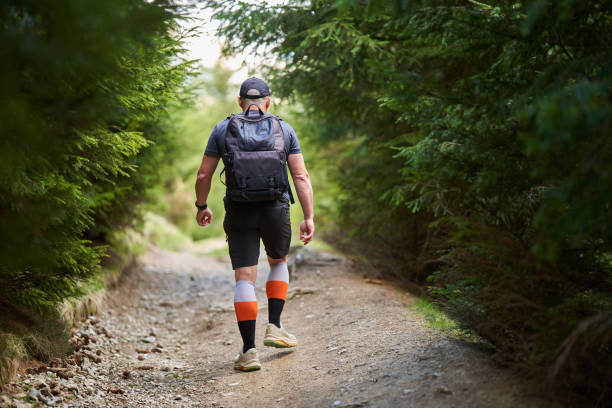 istock Hiker man with backpack in the mountains 2156973828