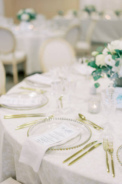 istock Festive menu on a plate surrounded by golden cutlery on the table 2156974070