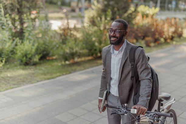 istock Businessman Commuting to Work With His Bicycle 2156974160
