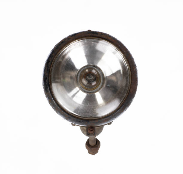 old vintage motorcycle headlight isolated on white background