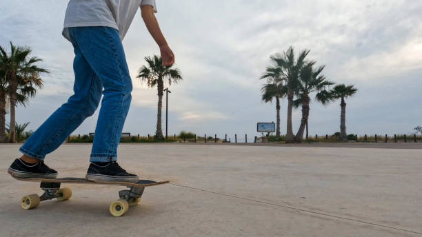 istock Young woman skateboards in courtyard 2156979691