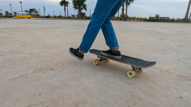 istock Young woman skateboards in courtyard 2156979758