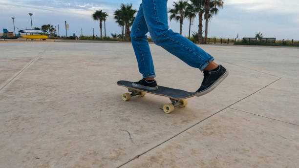 istock Young woman skateboards in courtyard 2156979759