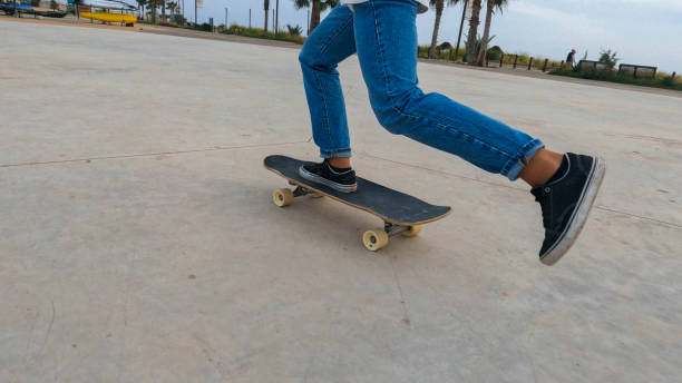 istock Young woman skateboards in courtyard 2156979919