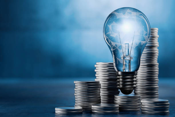 istock Business idea concept. Business plan. Glowing light bulb on a stack of coins. 3D render. 2156980681