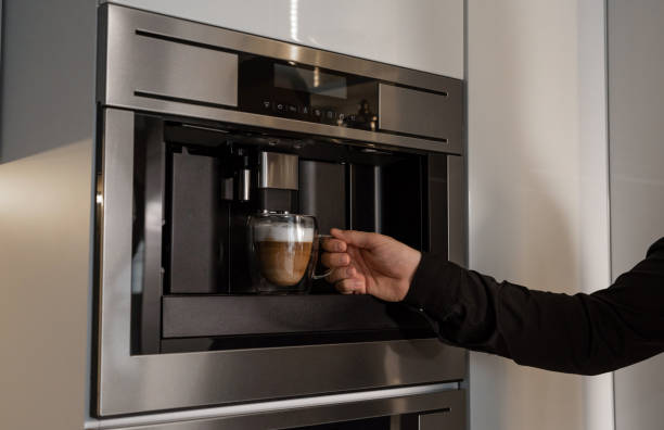 istock A man prepares coffee in a built-in coffee machine 2156980806