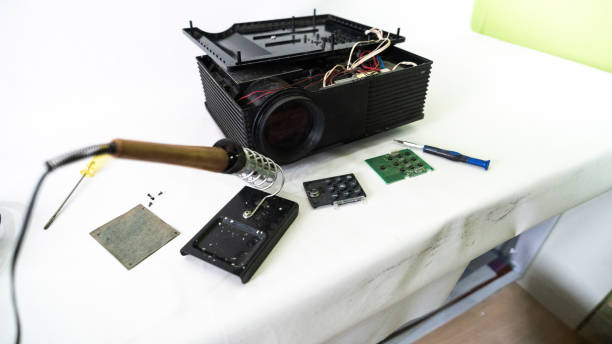 istock Video and multimedia projector open for maintenance with led lamp 2156983506