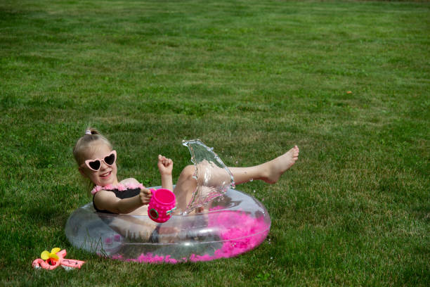 The family relaxes and has fun on their country property in the summer.
