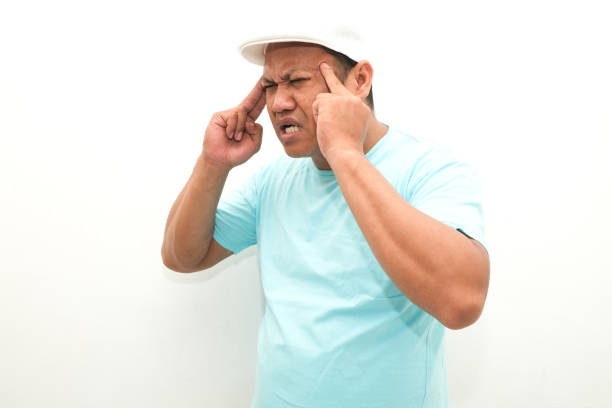 asian man feeling headache isolated on white background