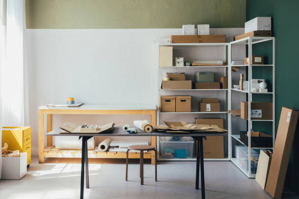 istock Organized Workspace With Shelves And Packing Supplies 2156987500