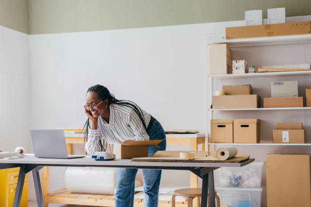 istock Woman Working On Laptop In Home Office For E-Commerce Business 2156987510